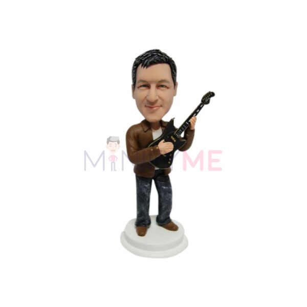 bobblehead of man and guitar